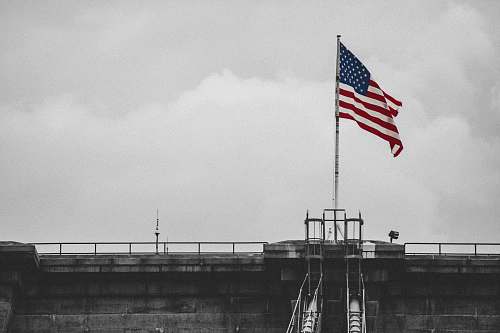 united states selective color photography of U.S.A. flag brooklyn bridge